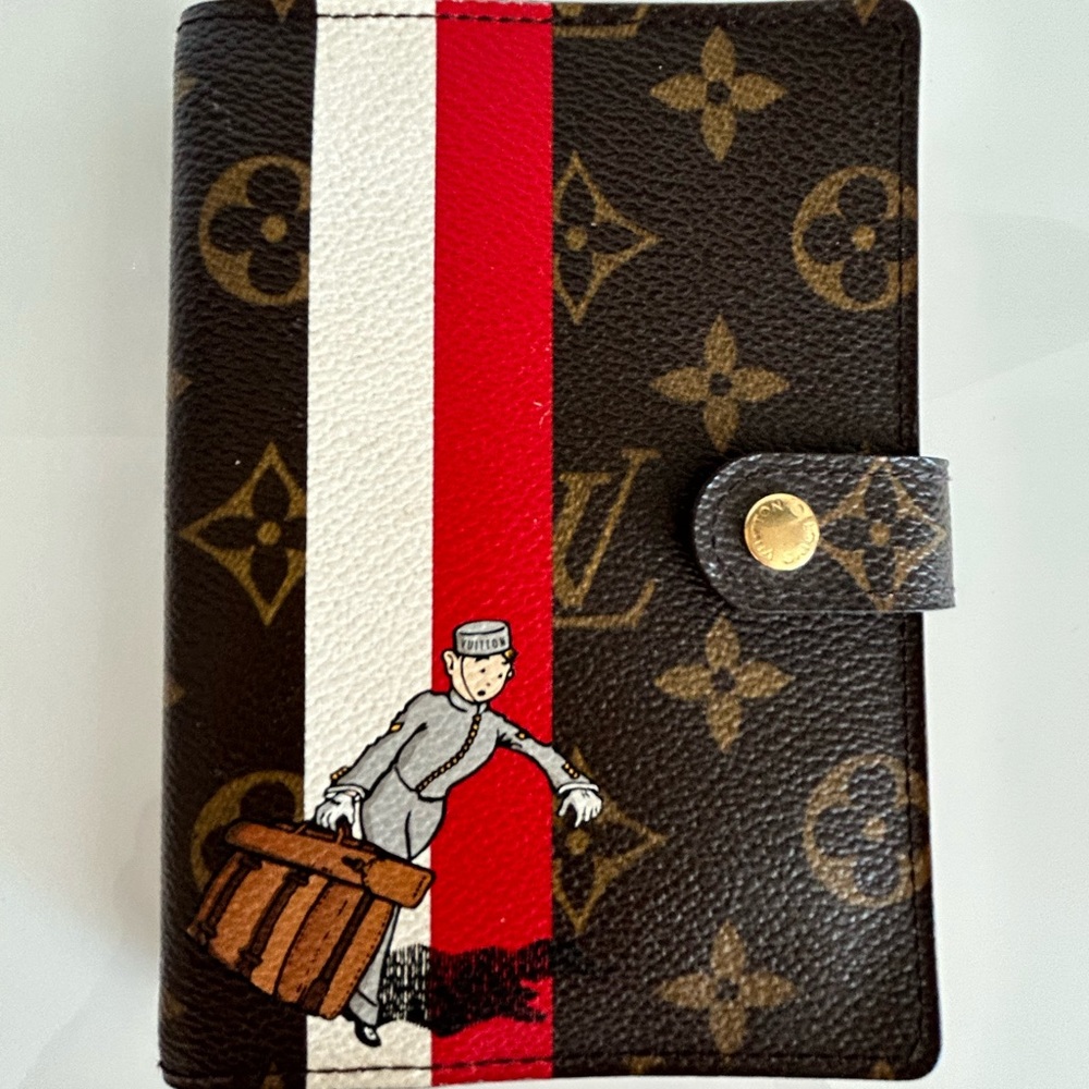 Louis Vuitton limited edition Traveling Man Calendar & Passport holder.